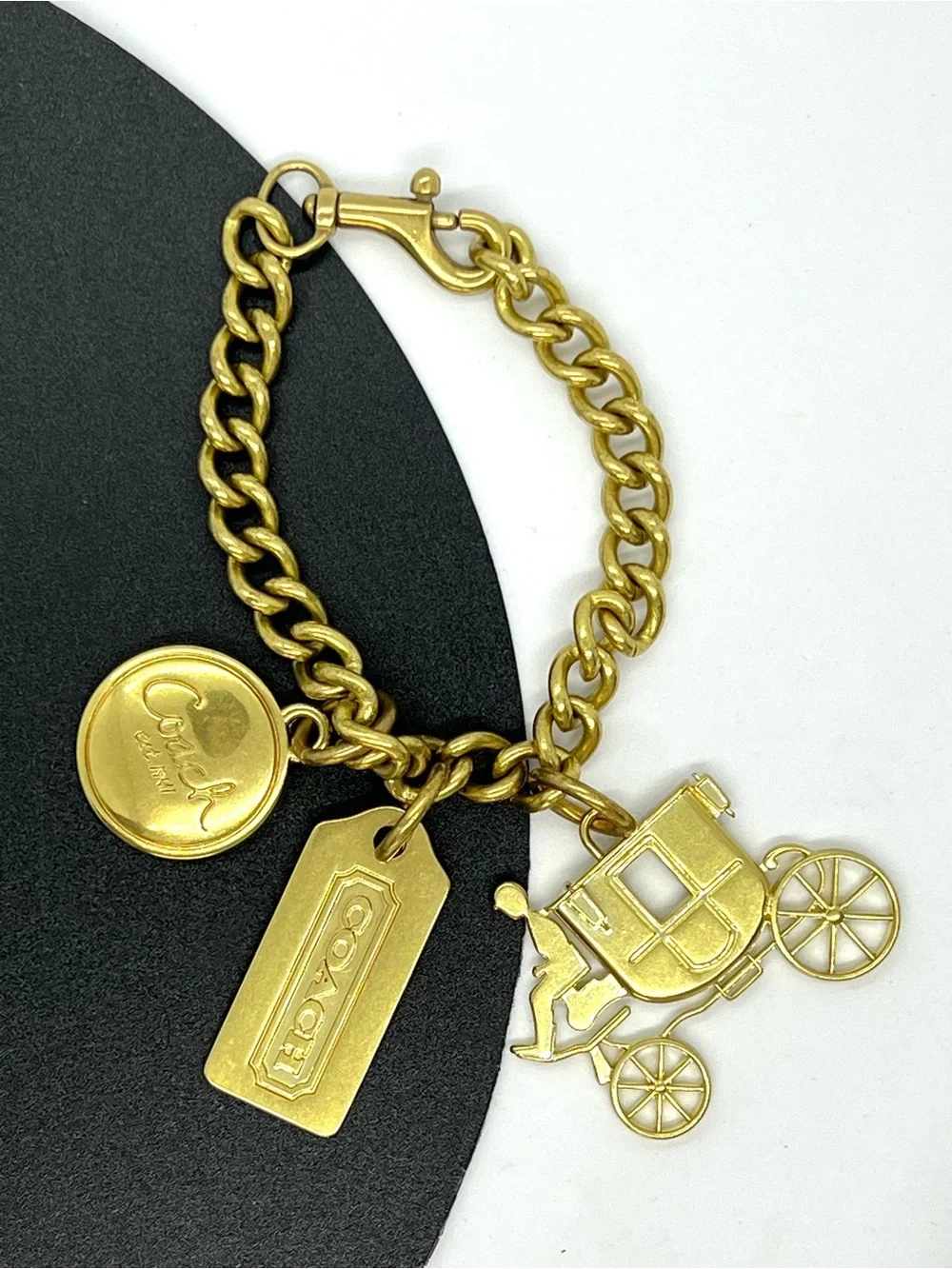 Coach Gold Tone Charm Bracelet with Carriage Charms